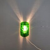 Old wall lamp made of hard pressed green glass.