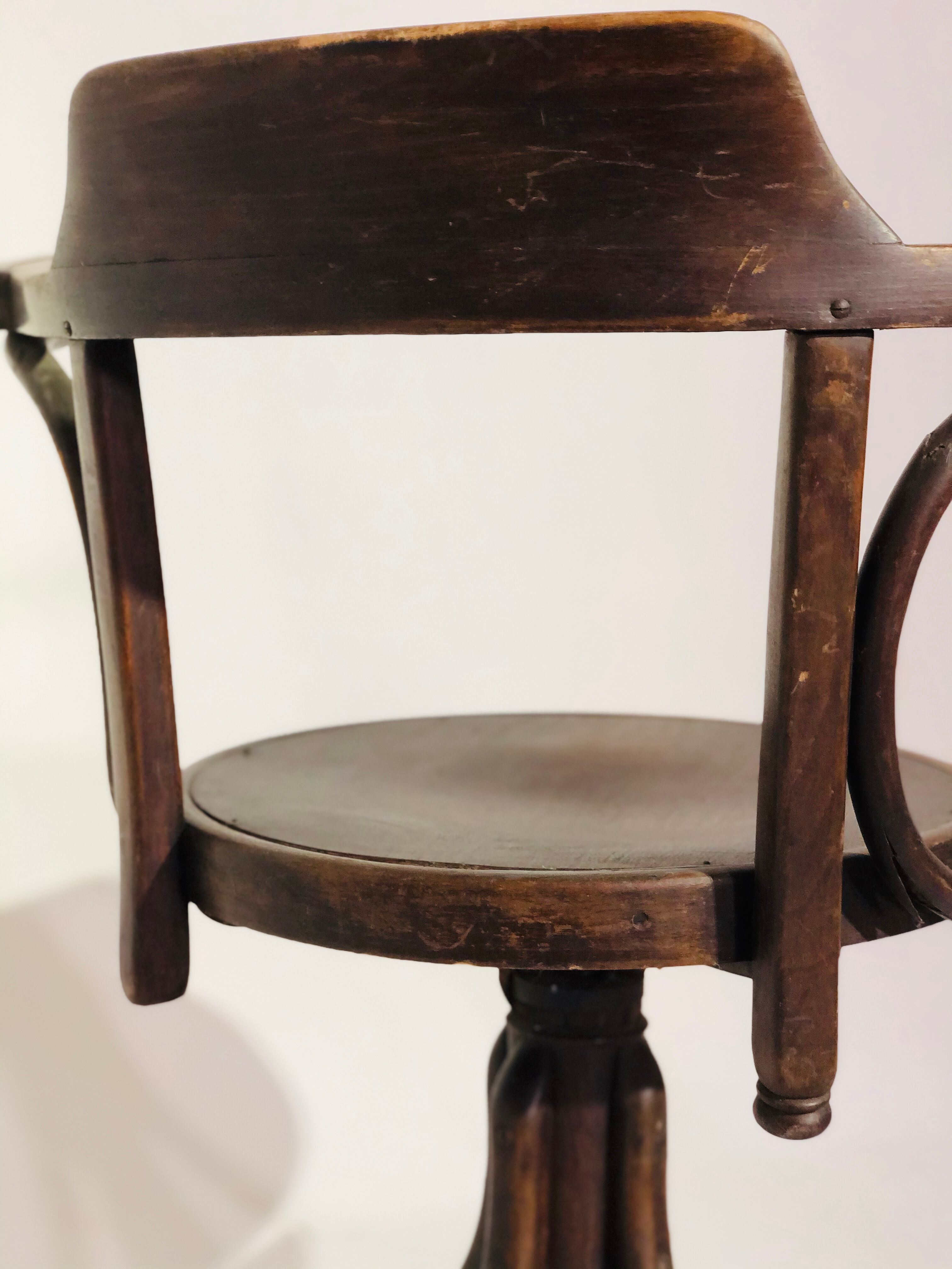 Swivel wooden armchair