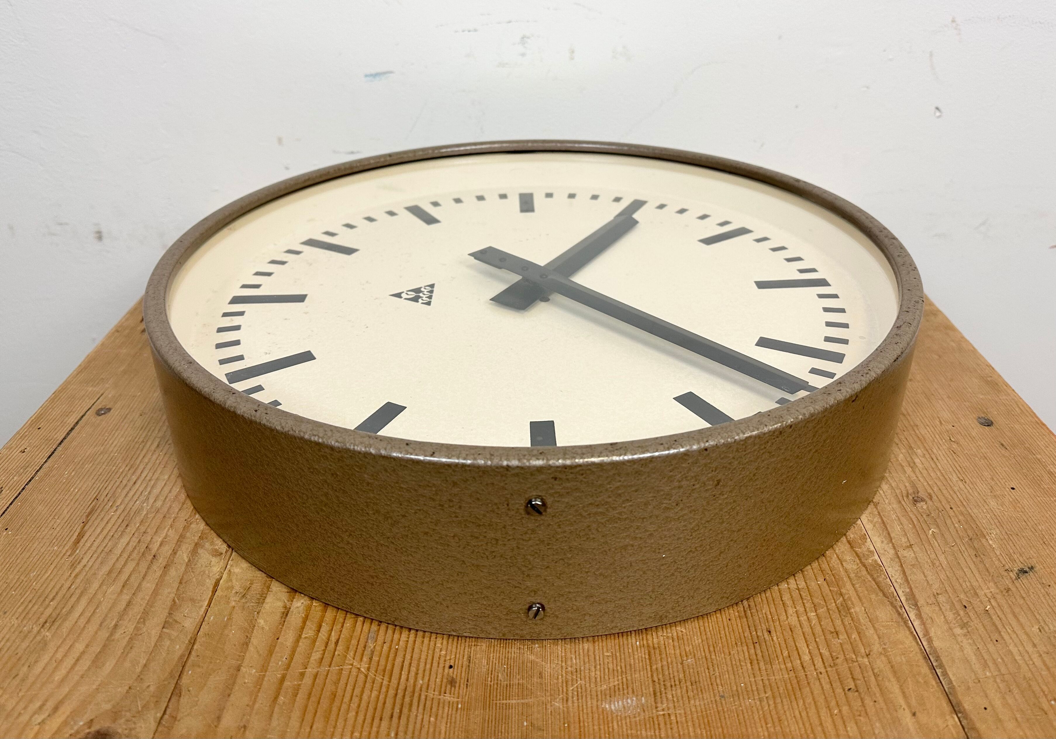 Brown industrial factory wall clock from Pragotron, 1960s