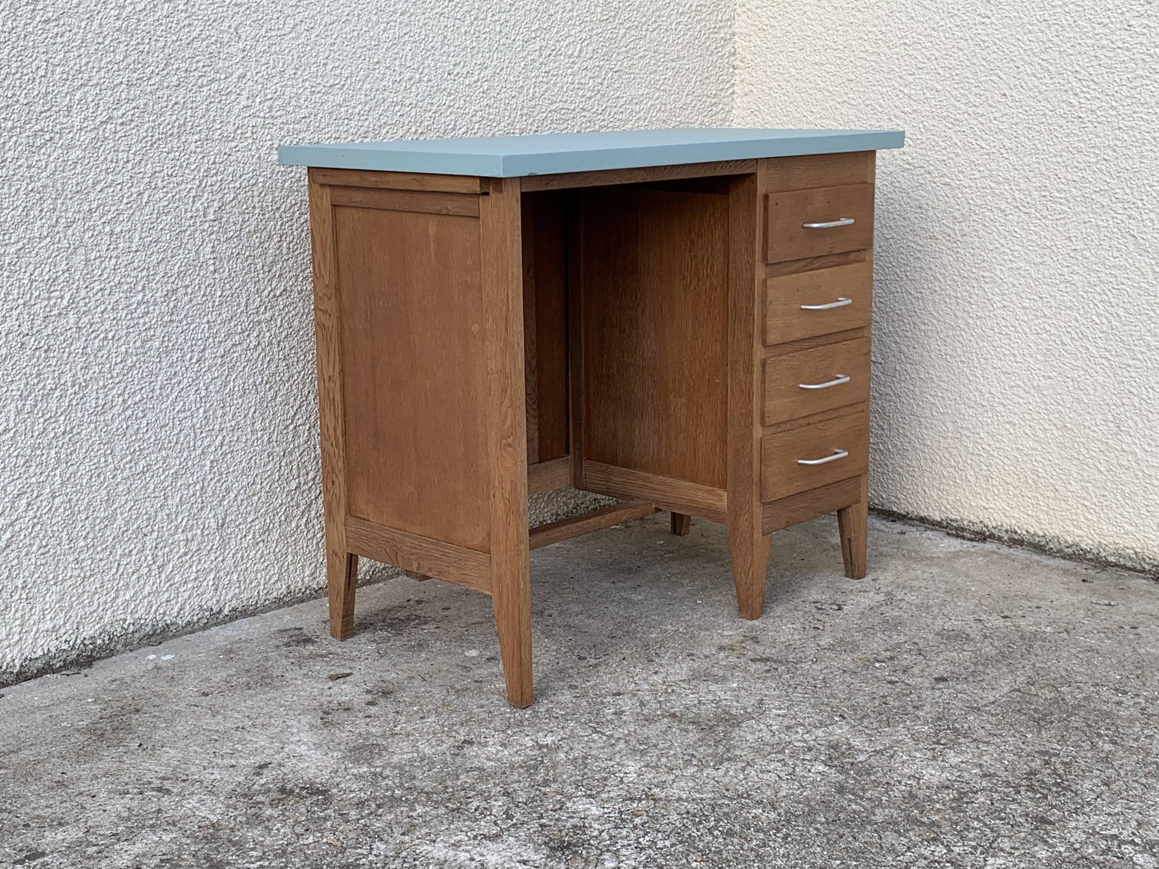 Vintage desk compass feet 1950 and its Baumann chair