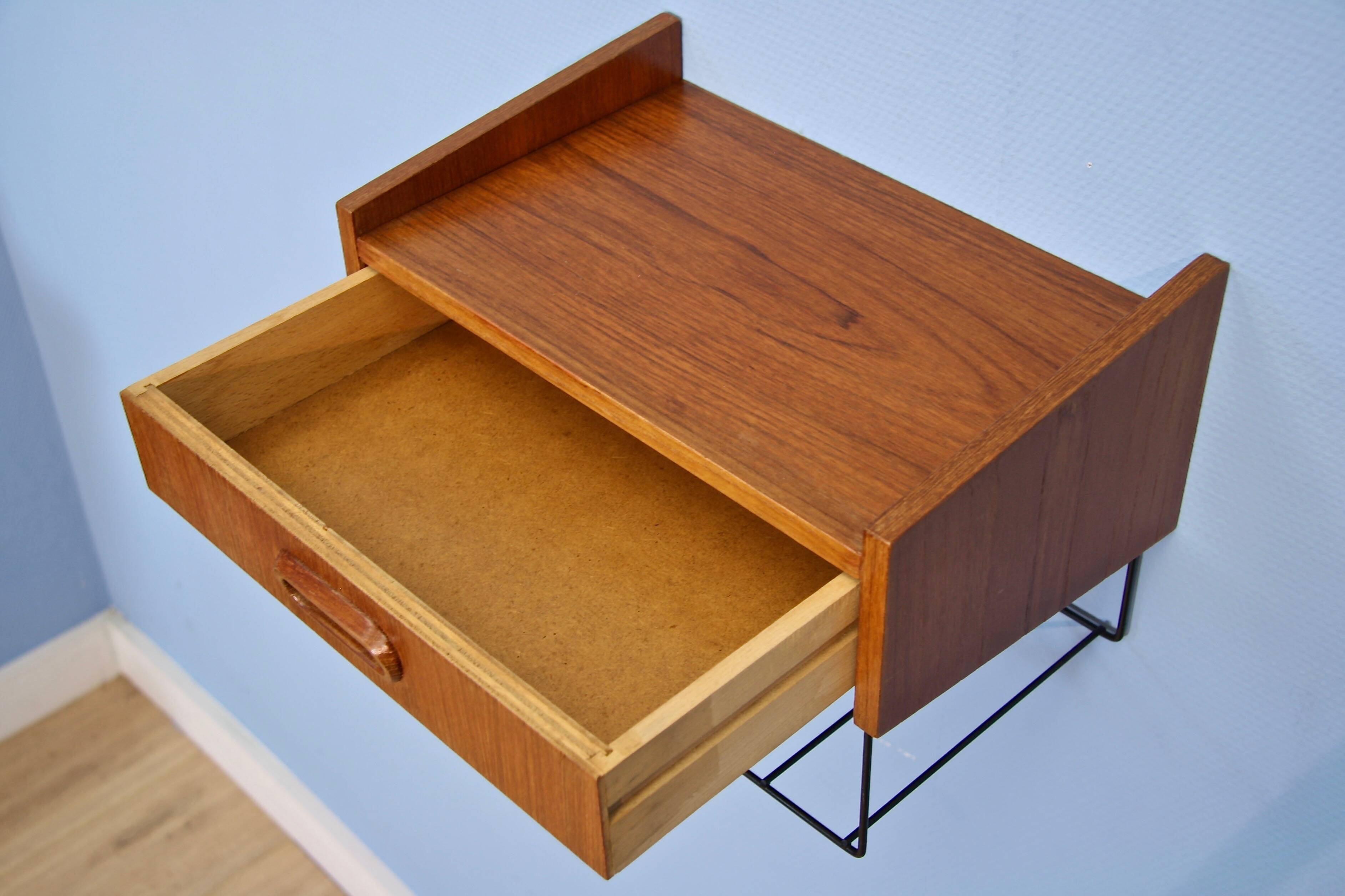 Dutch wall shelf by Tomado in teak and metal, 1960s.