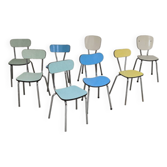 Set of 8 mismatched colored Formica chairs