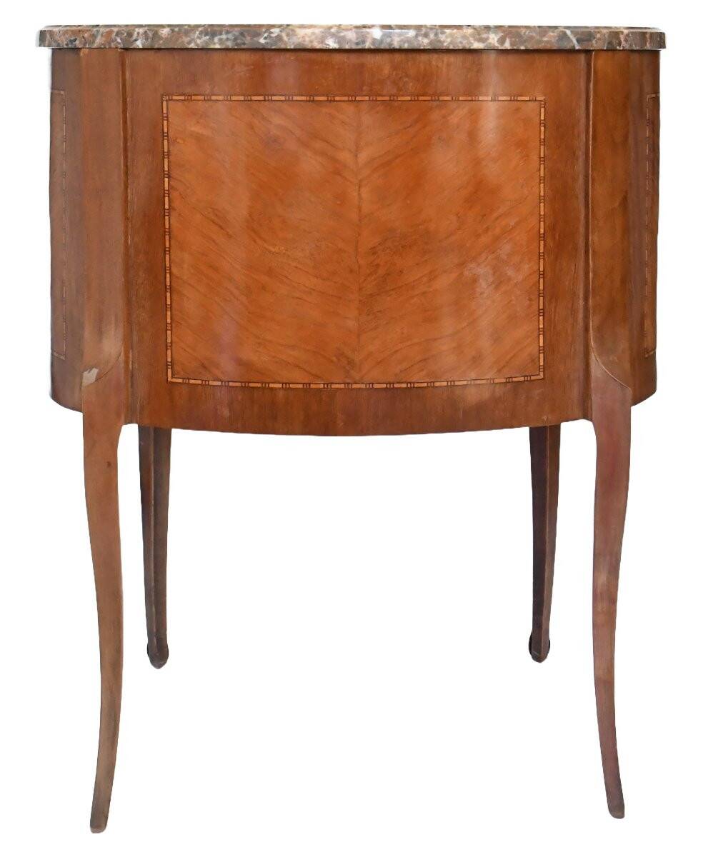 Small kidney-shaped chest of drawers in Transition style.