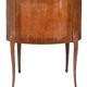 Small kidney-shaped chest of drawers in Transition style.