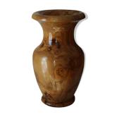 Artisanal turned olive wood vase with varnish.