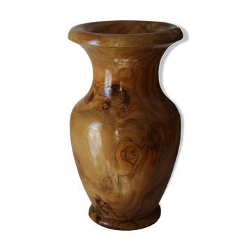 Artisanal turned olive wood vase with varnish.