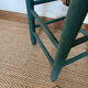 Vintage stool in green patinated wood and straw
