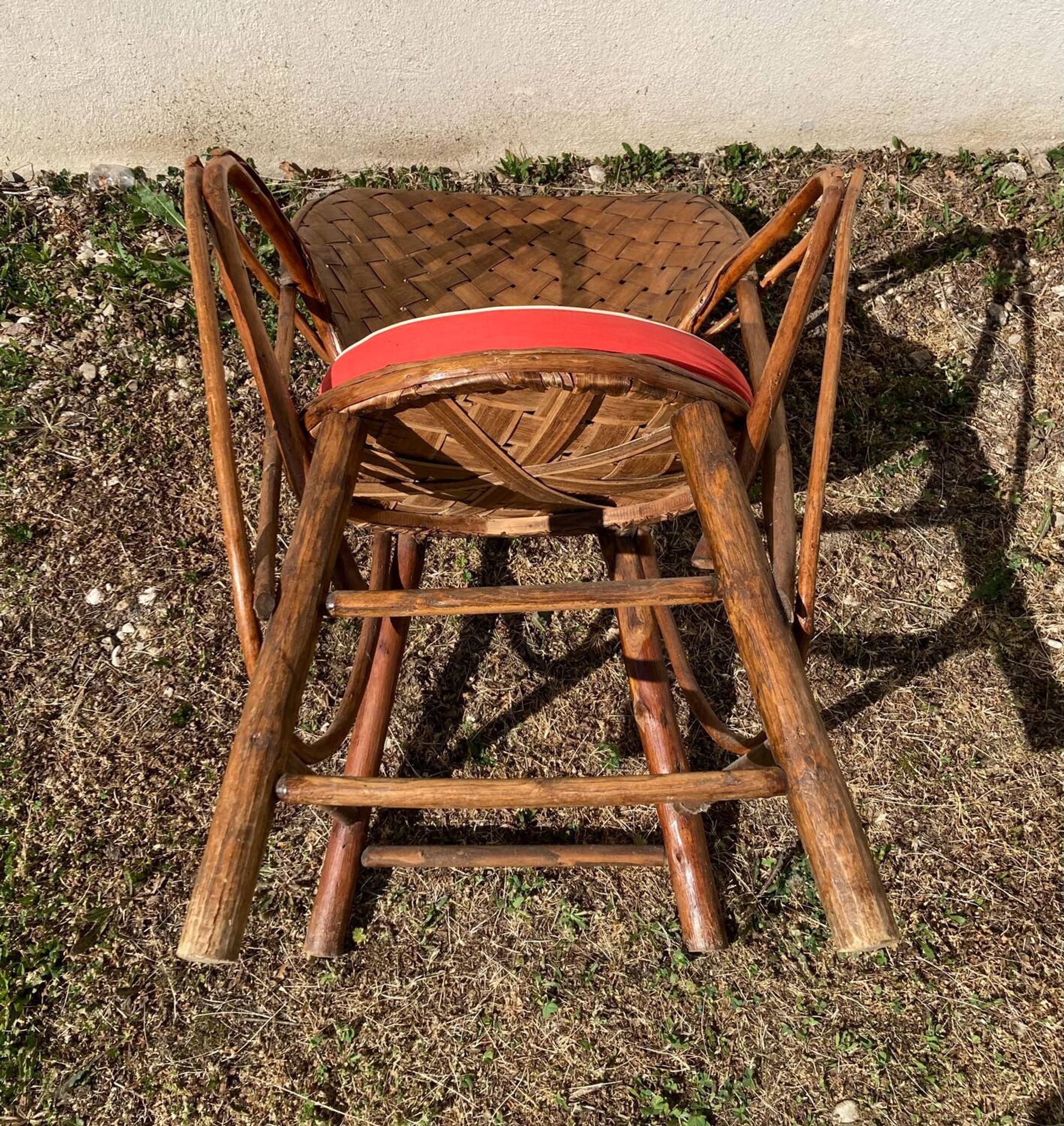 Vintage 1970s armchair in curved woven chestnut + seat cushion