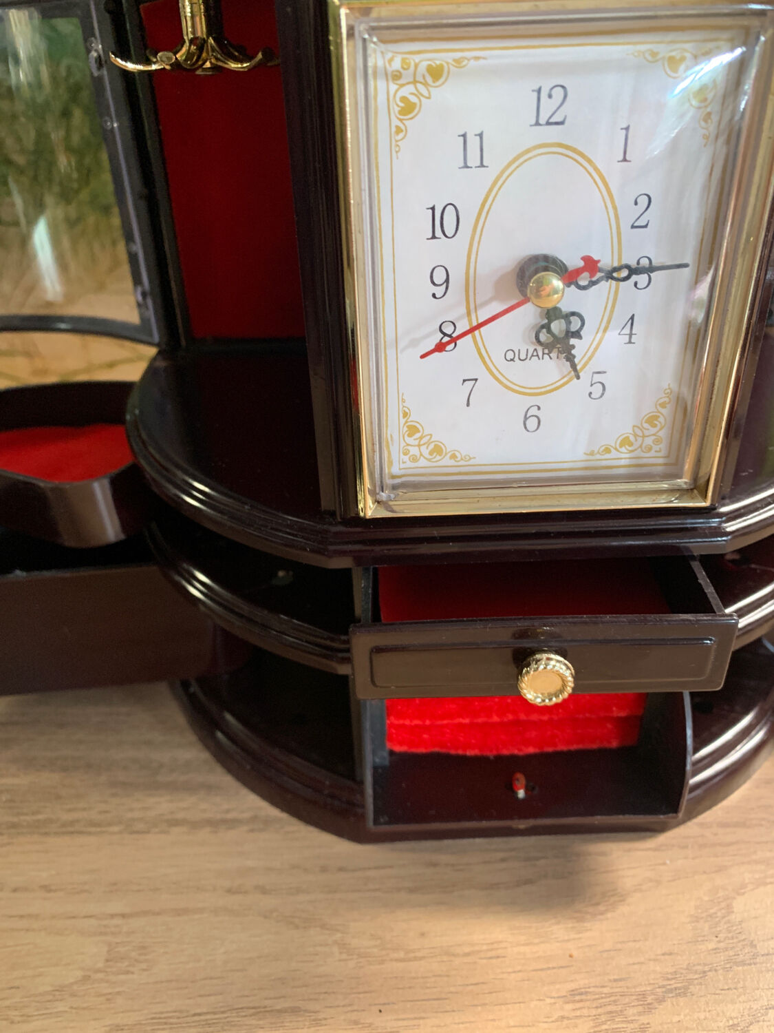 Jewelry cabinet with clock