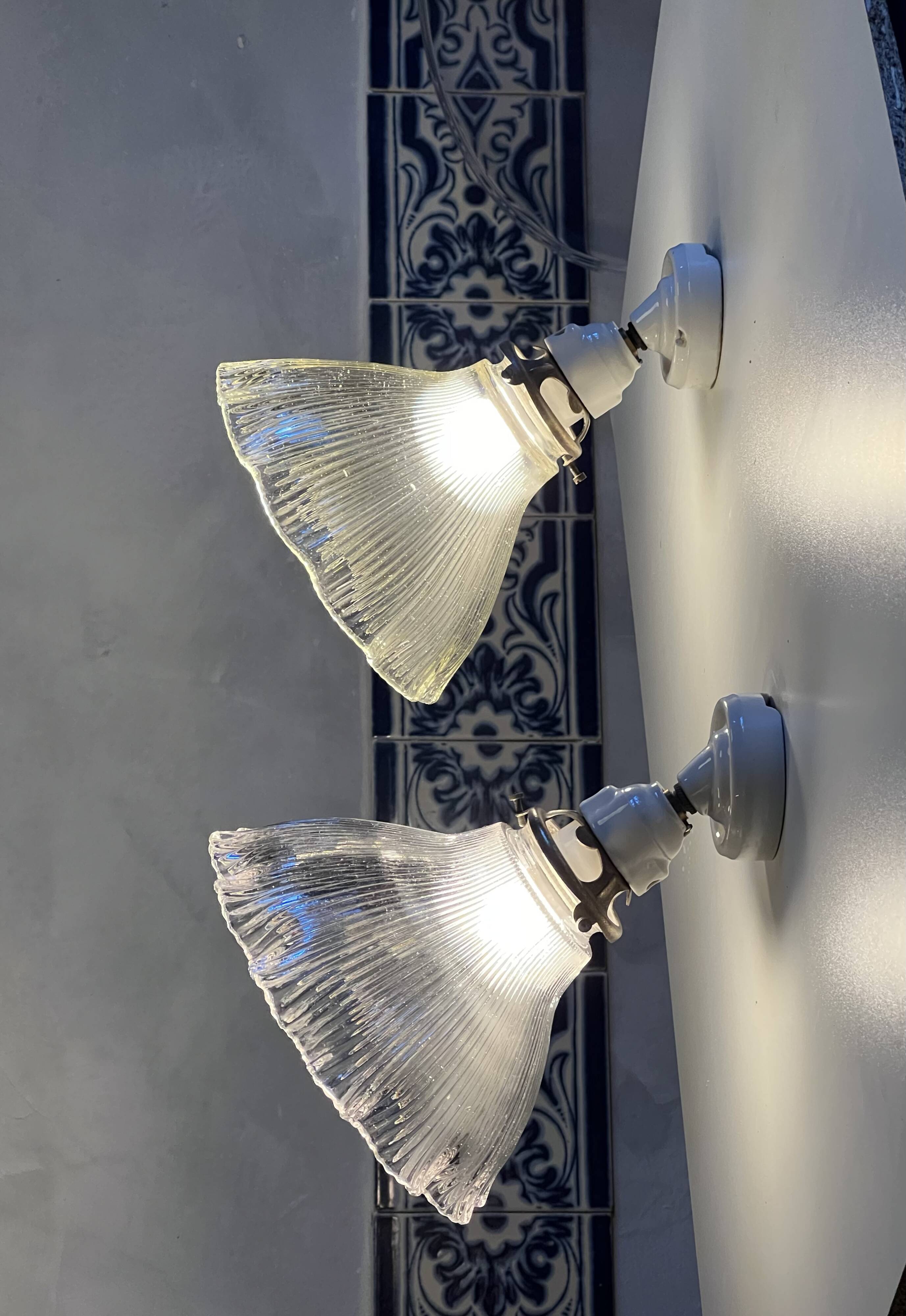 Holophane wall lights with bistro-style porcelain supports