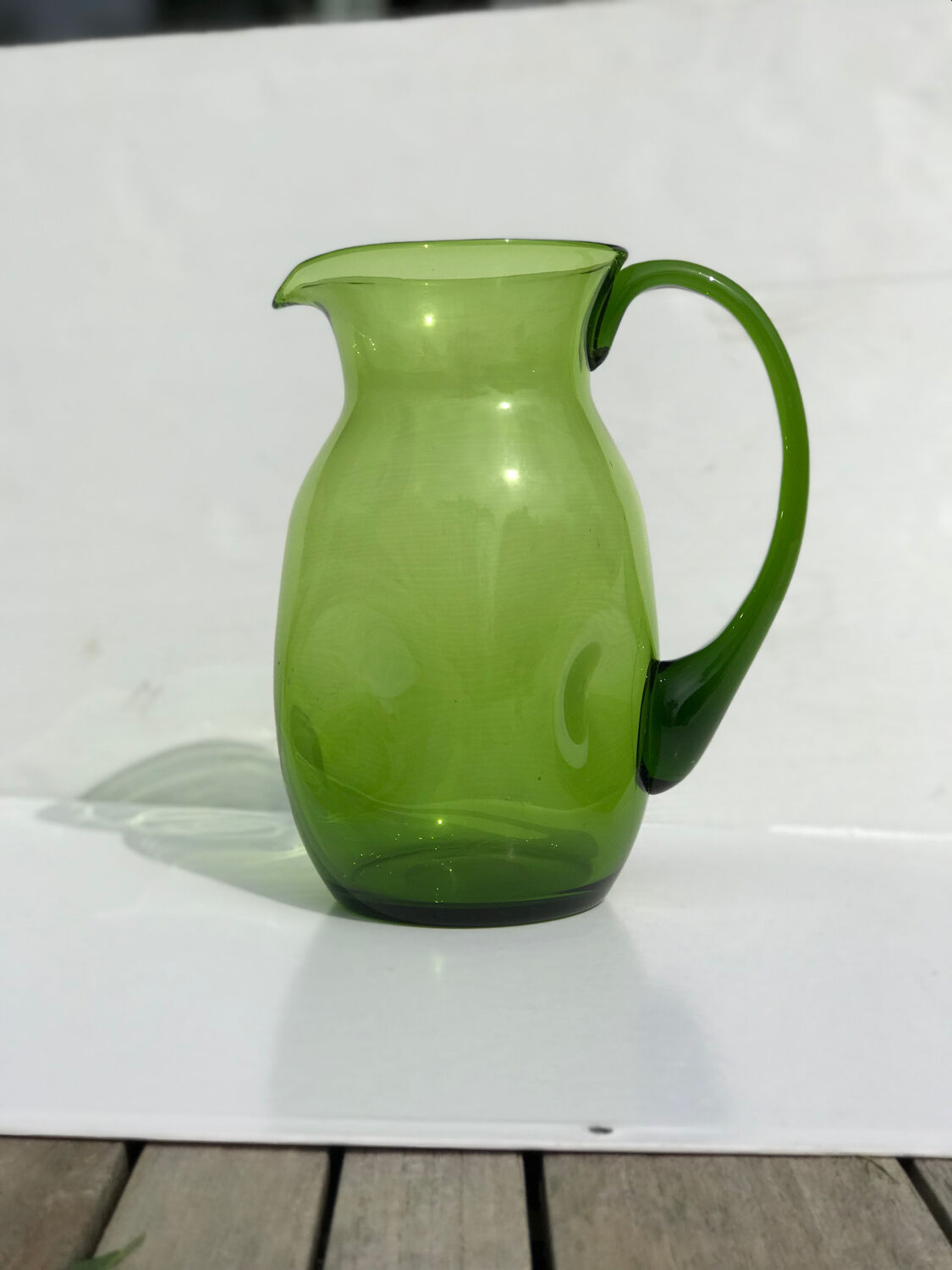 Green water jug in blown glass