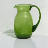 Green water jug in blown glass