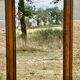 Large and old bevelled framed floor mirror.