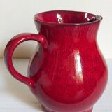 Vintage red enamel ceramic pitcher