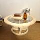Oval patinated wood and beveled glass coffee table