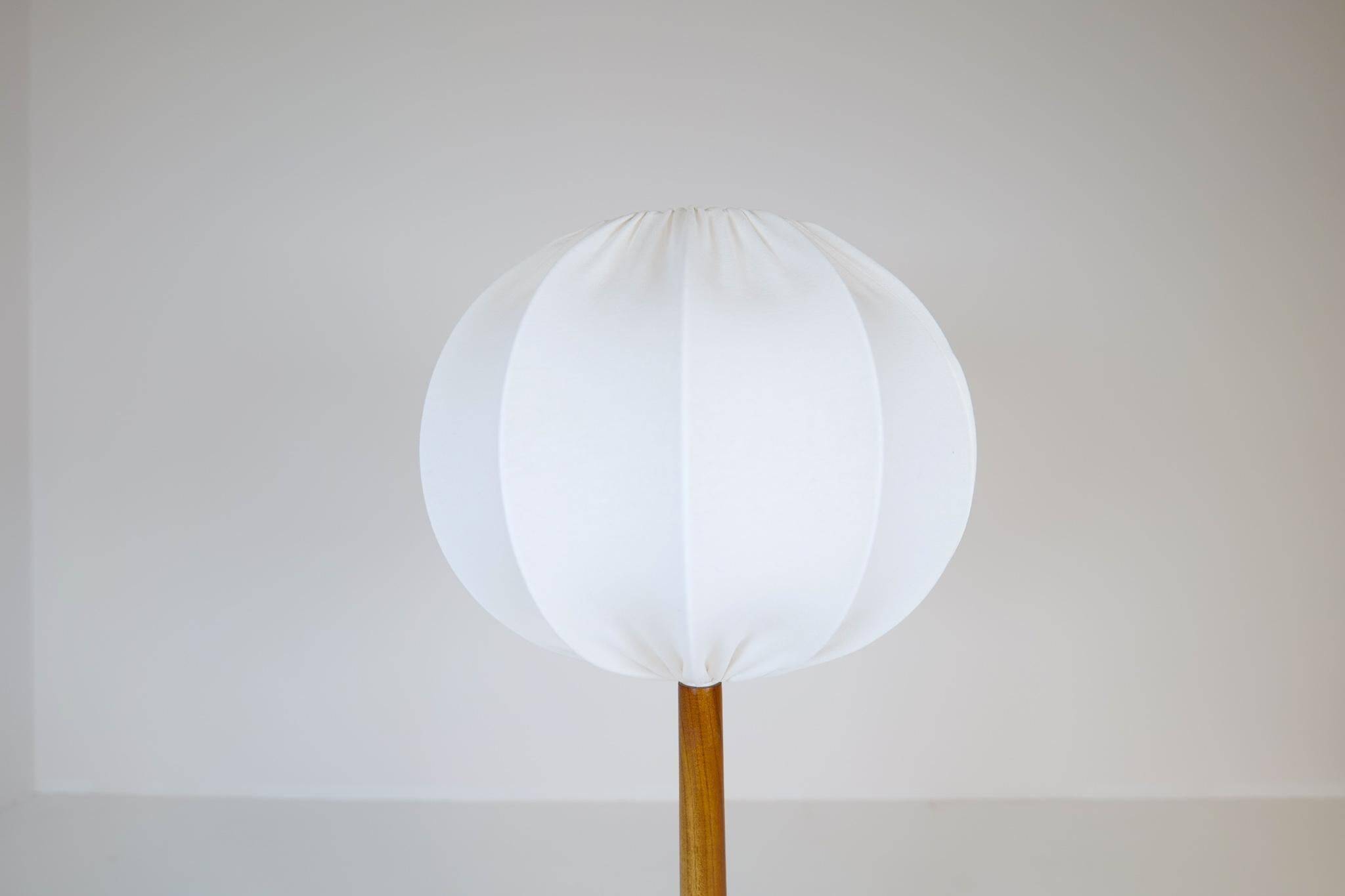 Mid-century solid teak table lamp from the 1960s Sweden.