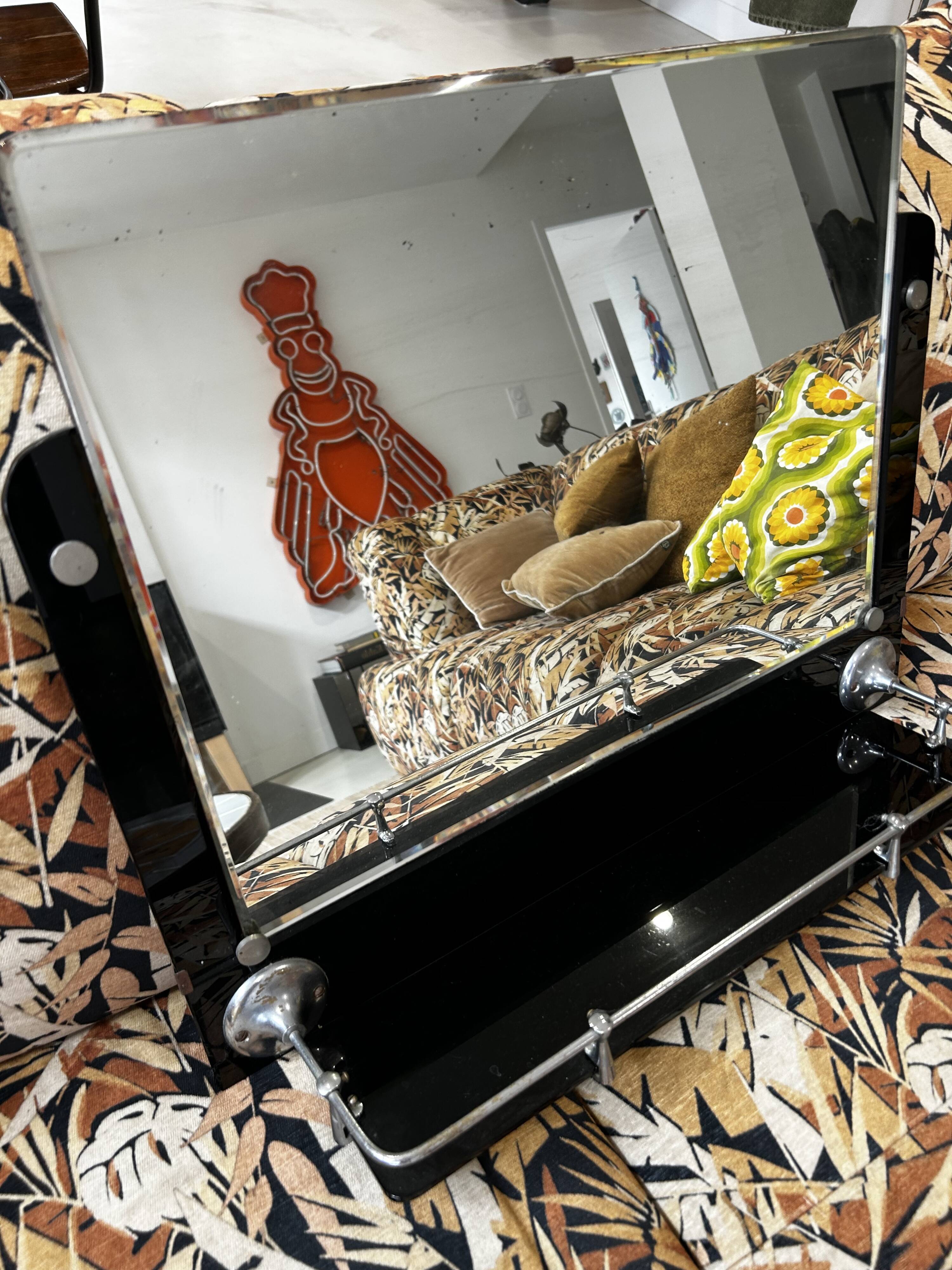 Vintage black mirror from the 1930s/40s with shelf.