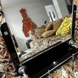 Vintage black mirror from the 1930s/40s with shelf.