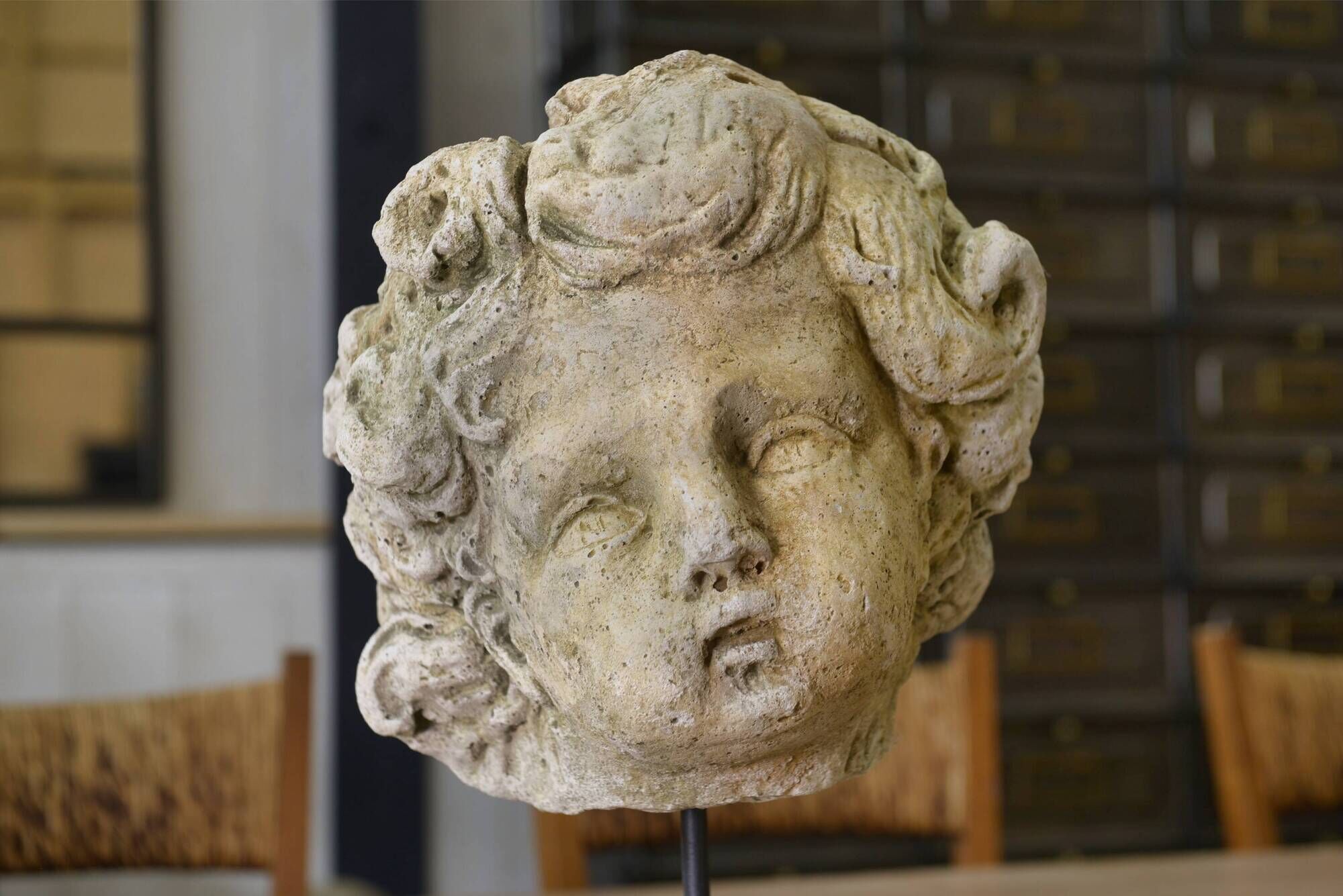 Reconstituted stone sculpture in antique style from the 20th century.