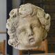 Reconstituted stone sculpture in antique style from the 20th century.
