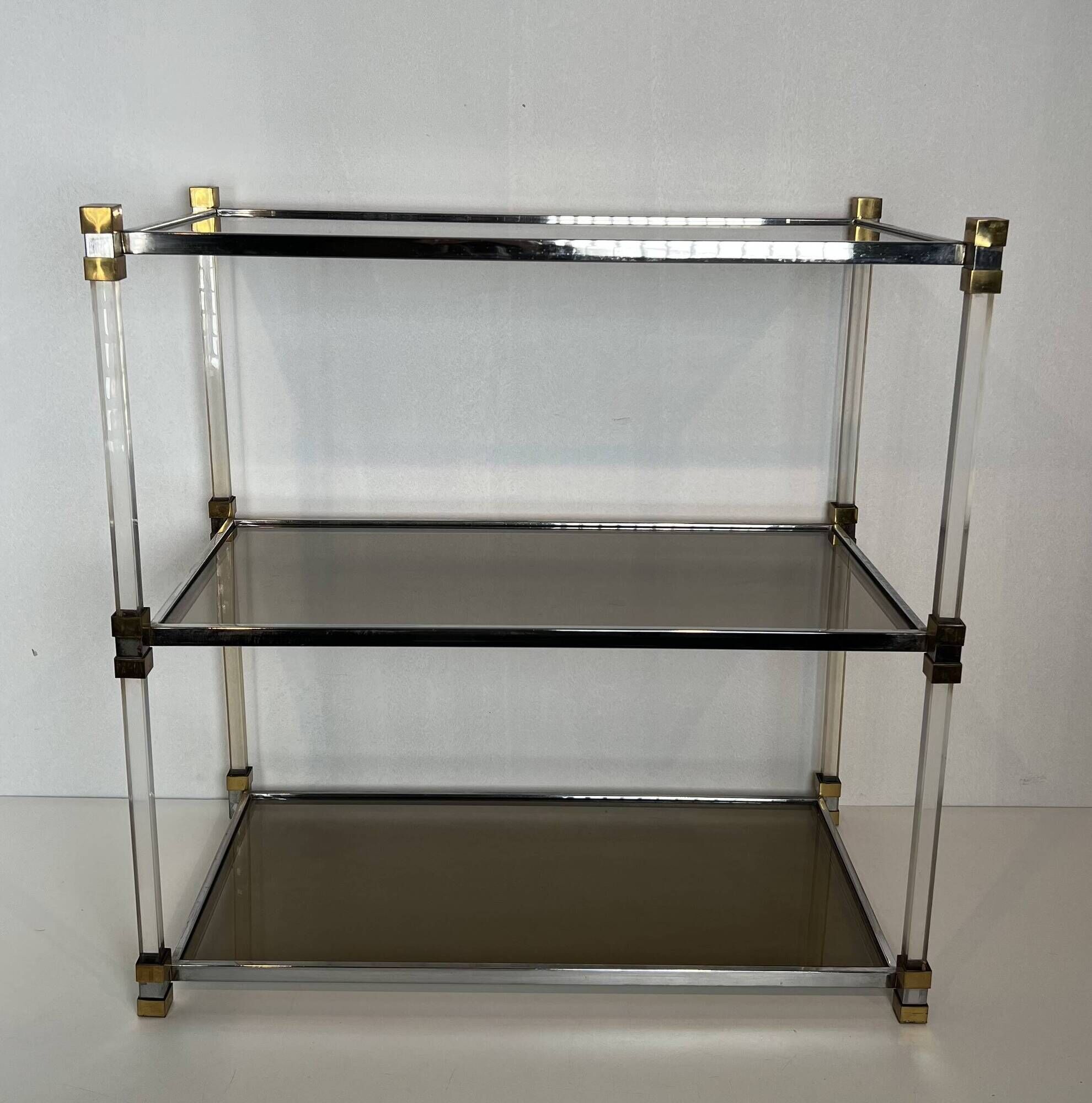 Lucite Shelf with Three Smoked Glass Shelves and Brass Ends. Work