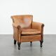 Vintage sheepskin armchair with a beautiful light colour and elegant legs