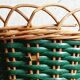 Cache-pot and its matching pencil holder in dyed woven rattan from the 1960s.
