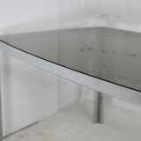 Living table. chrome metal, curved smoked glass slab, france, circa 1970.