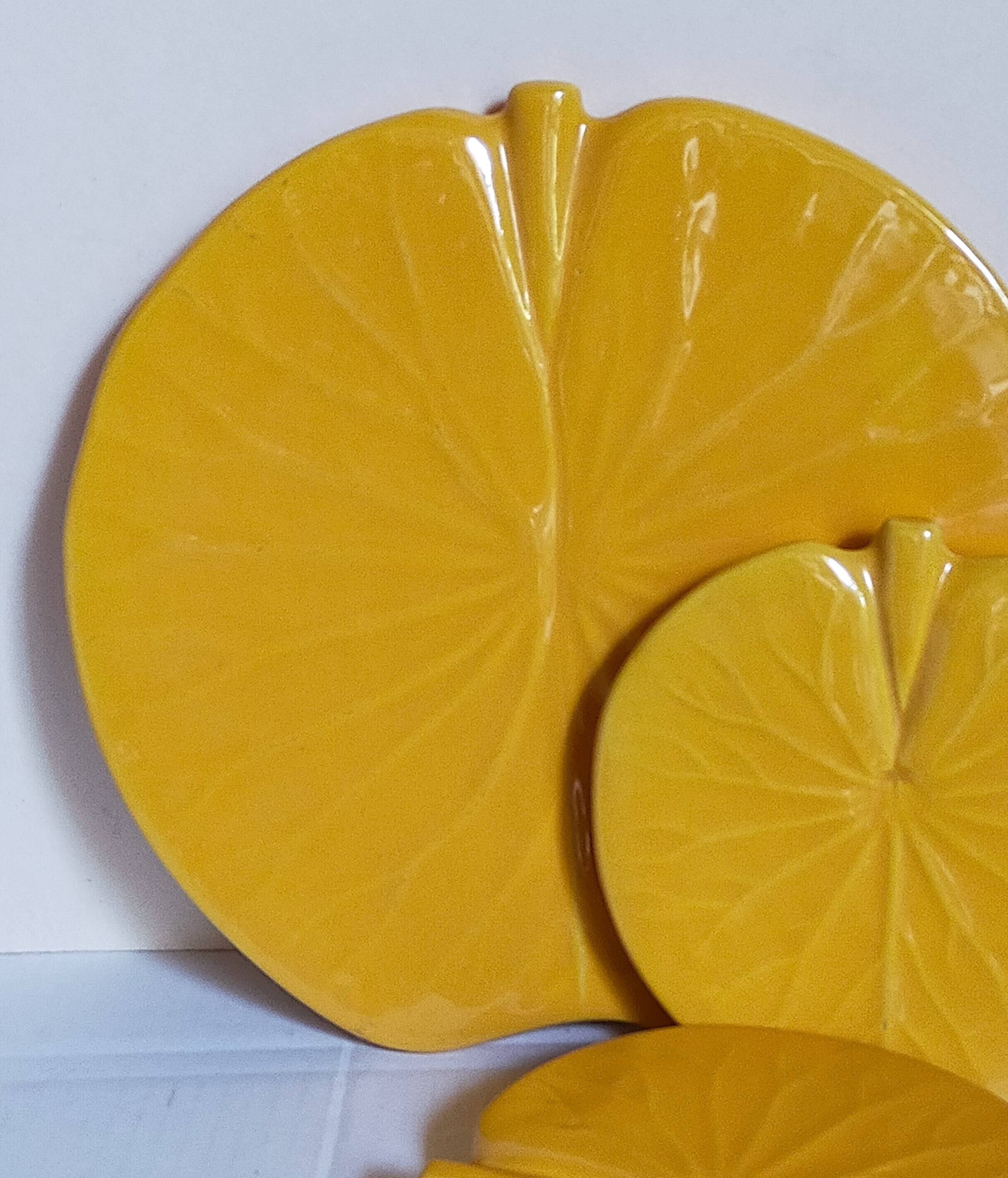 Three vintage water lily presentation dishes in slip