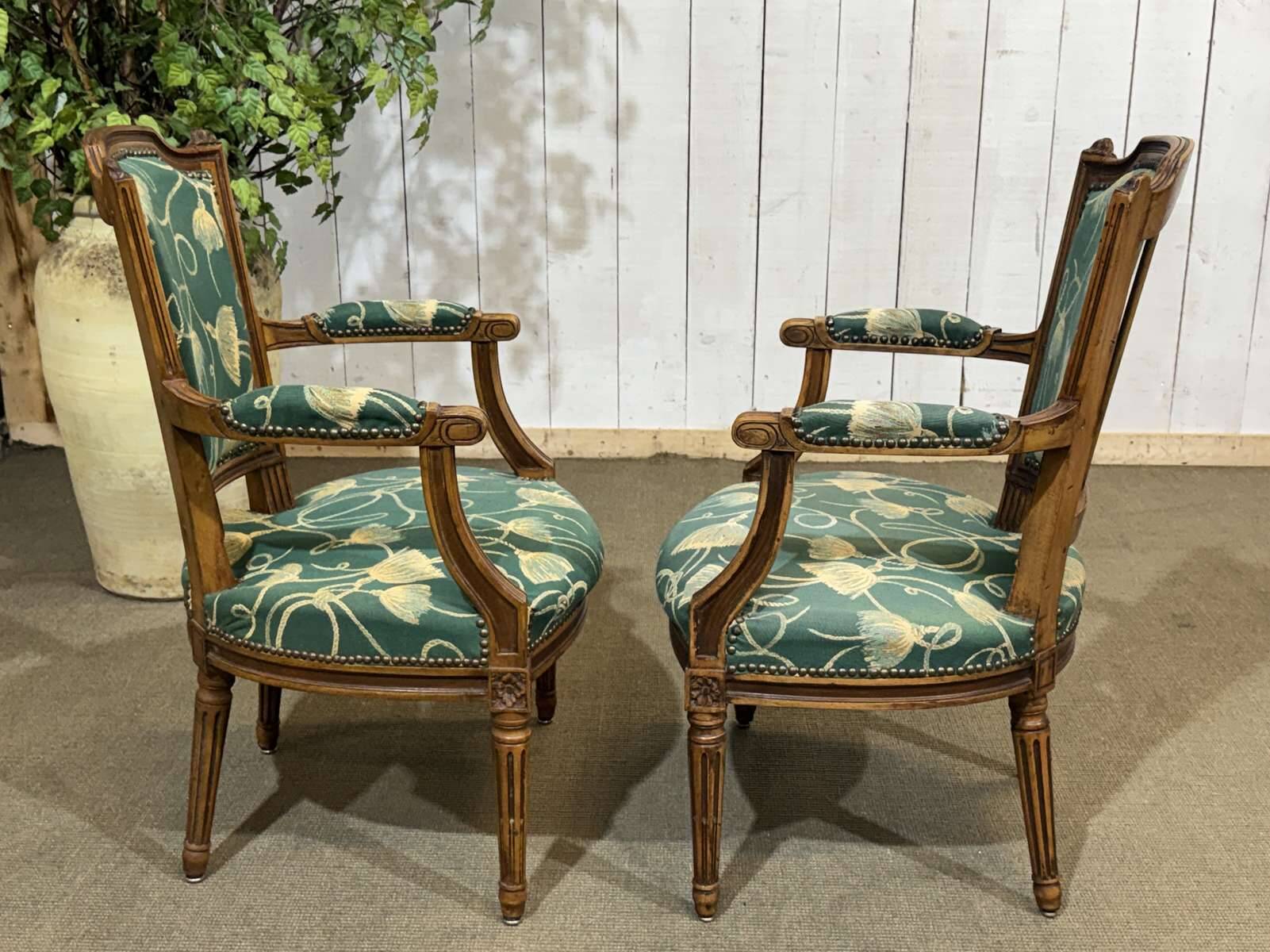Pair of Louis XVI style armchairs in beech from the 19th century.