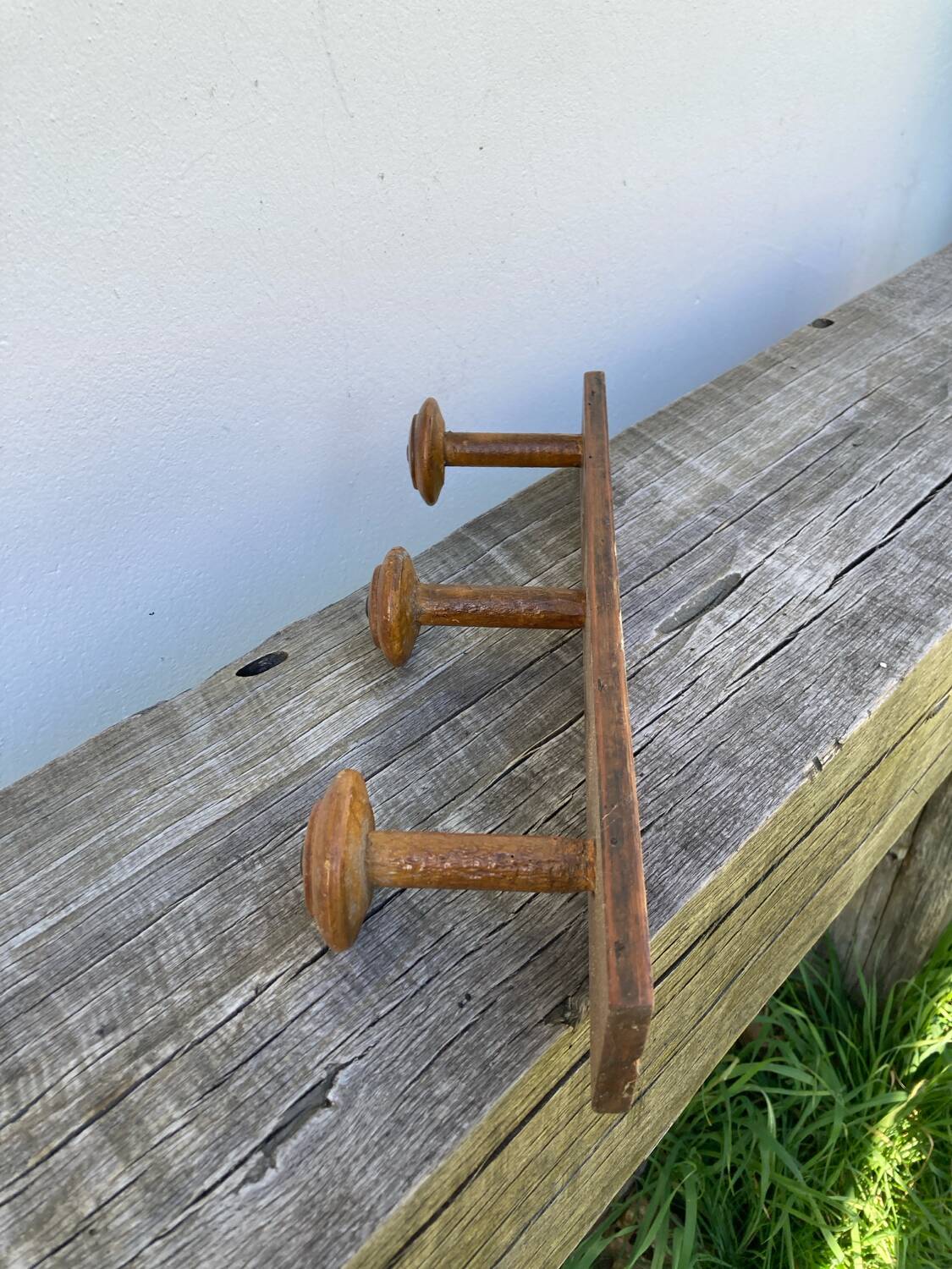 Old wooden wall coat rack