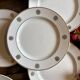 Set of 10 vintage white and gold dessert plates.