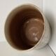 Traditional raku ceramic tea or matcha bowl with mark on the base