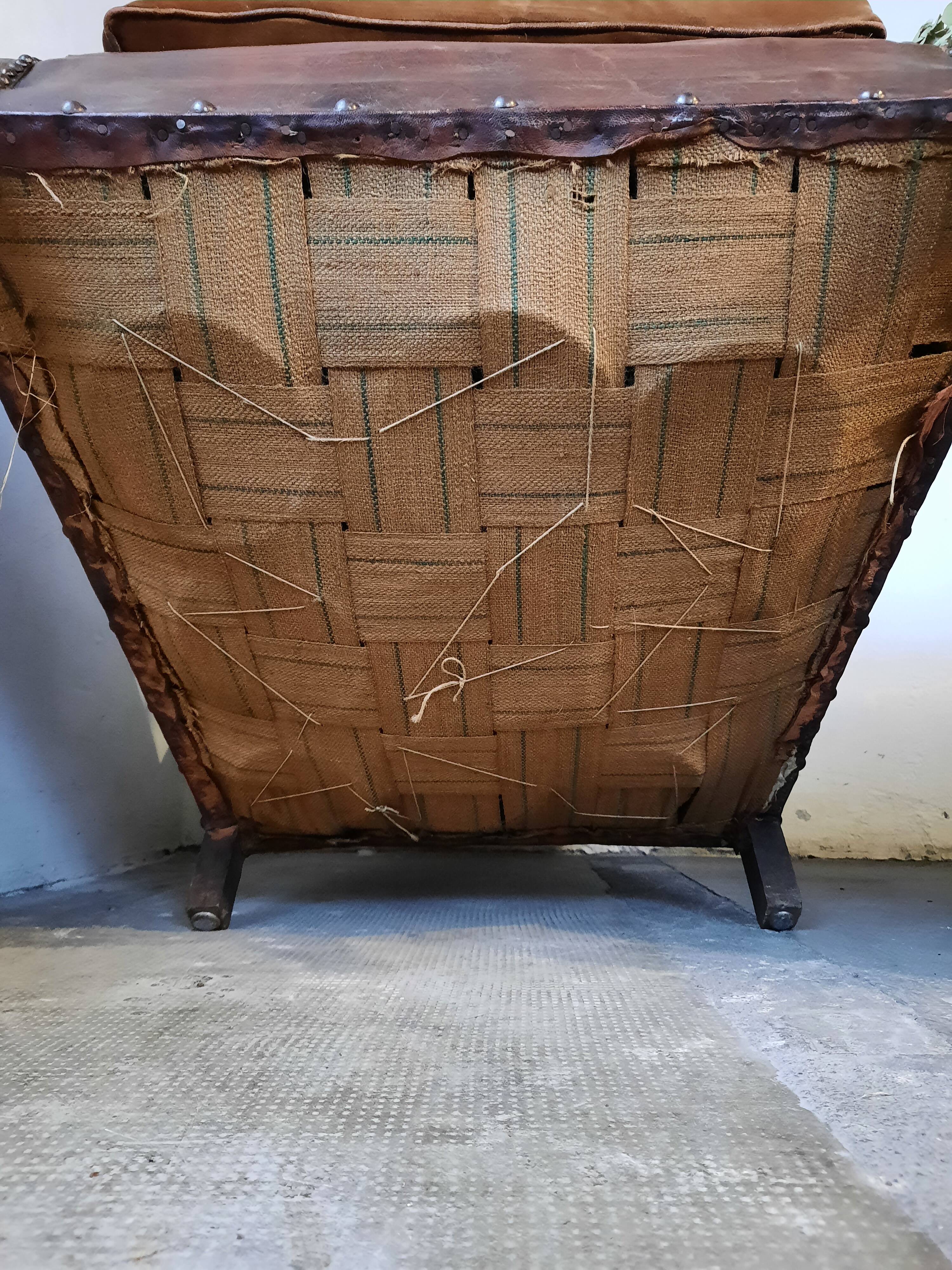 Old studded leather club chair 1930-1930