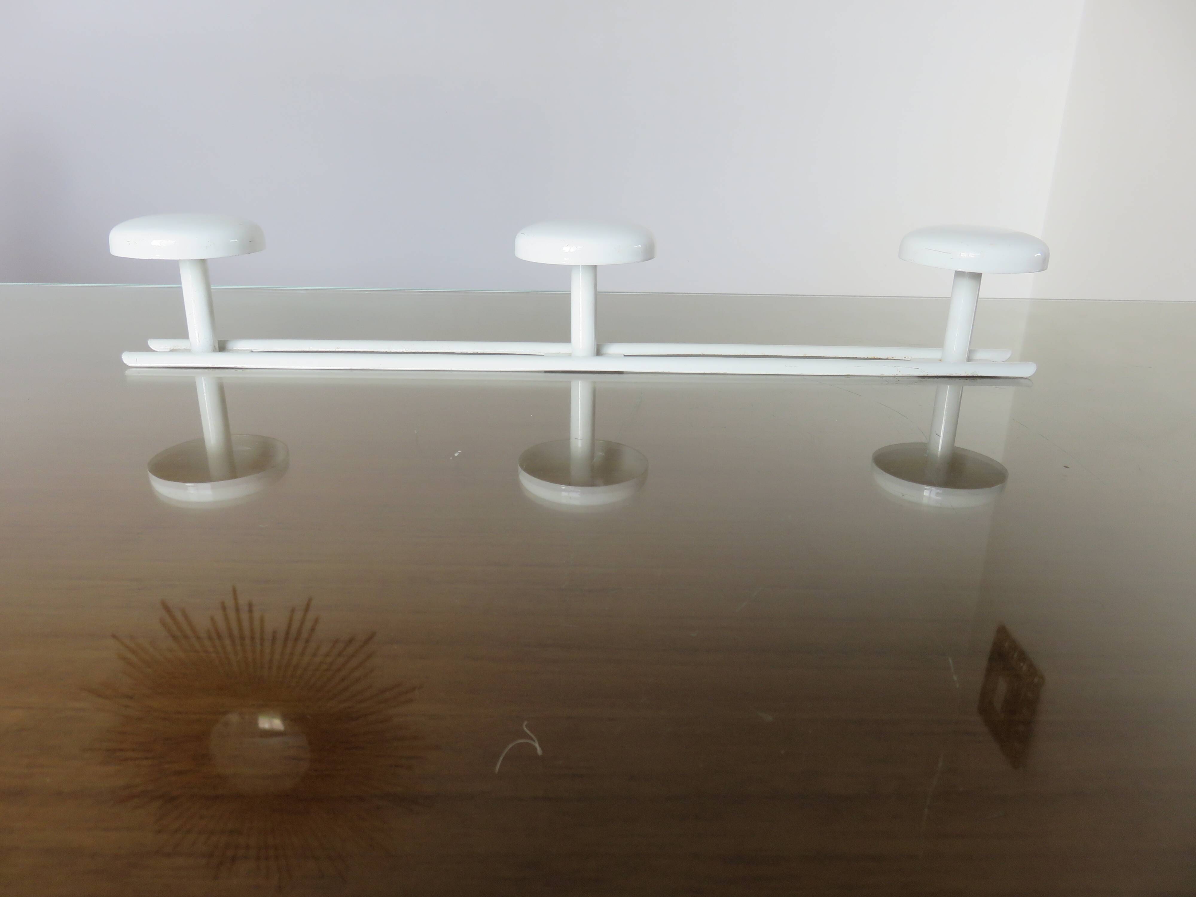 White lacquered metal wall coat rack with 3 hooks, 1970.