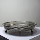Small Moroccan tripod tea tray in silver-plated metal, vintage chiseled decoration.