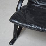 Black leather armchair and canning