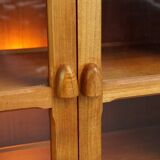 Elegant vintage Danish display cabinet with glass panels and atmospheric lighting