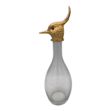 Glass bottle type carafe with gold metal bird head stopper