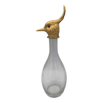 Glass bottle type carafe with gold metal bird head stopper