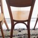 Set of 4 light wood bistro chairs stamped Baumann and Thonet.