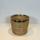 Rattan and brass wastepaper basket in the style of Gabriela Crespi.
