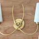 Pair of 1960 wall lamps in gilded brass and glass.