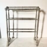 Old bathroom towel rack in patinated wood