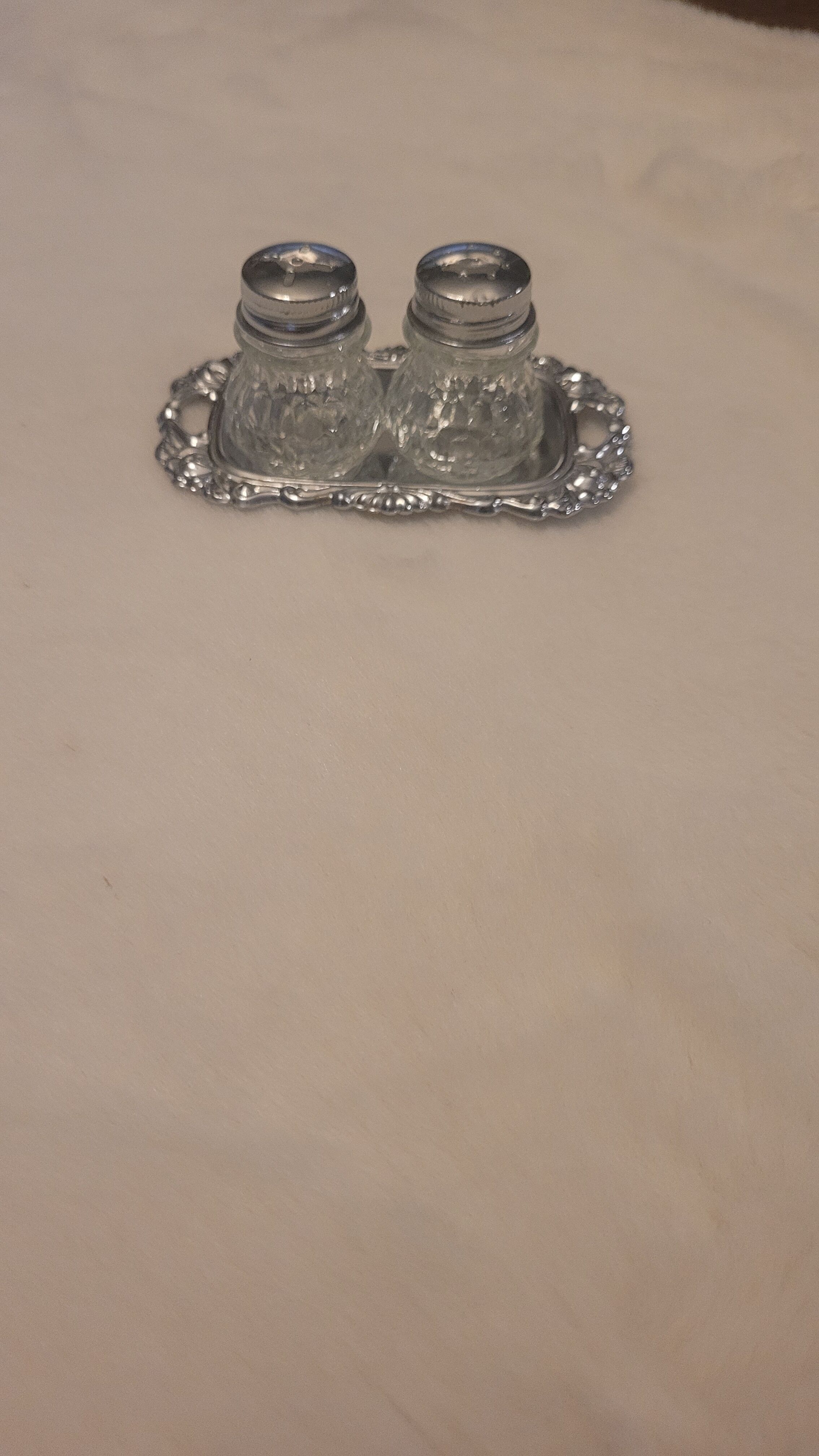 Salt and pepper and silver tray