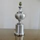 Brushed aluminum and chrome lamp typical of the 70s