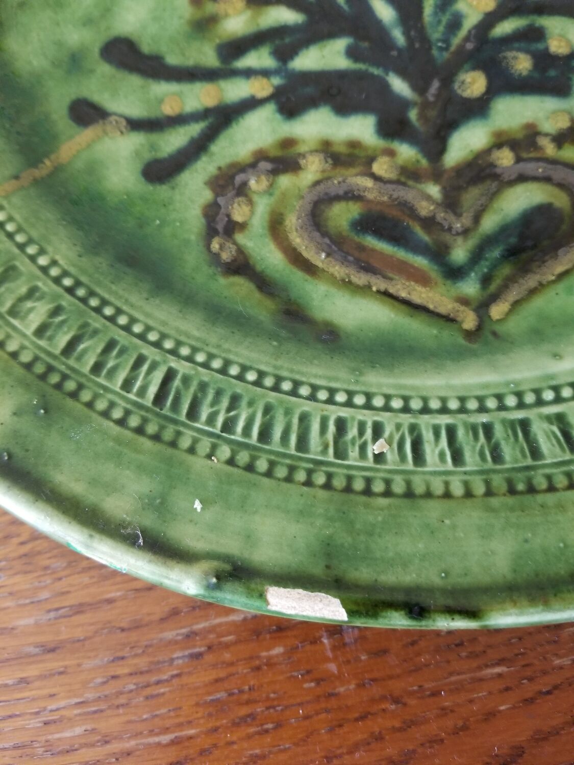 Green earth dish with a pattern from the manufacture Saint Jorioz Annecy