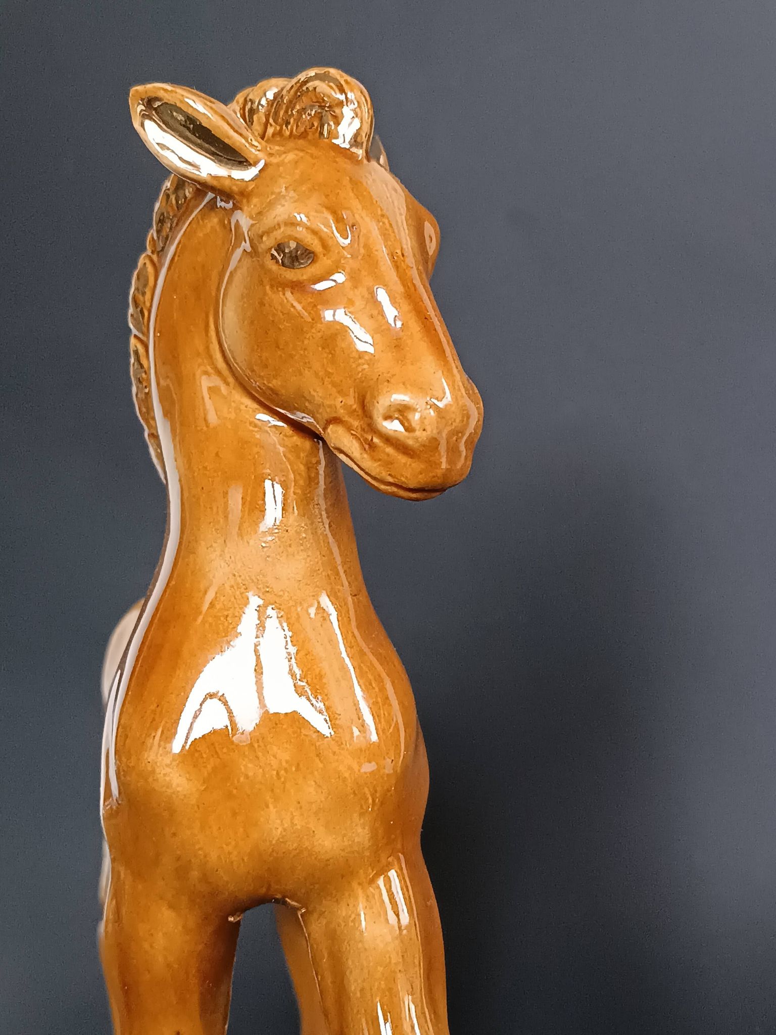 Ceramic horse sculpture with wild glaze and gold, signed Art Deco.