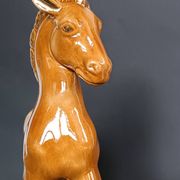 Ceramic horse sculpture with wild glaze and gold, signed Art Deco.