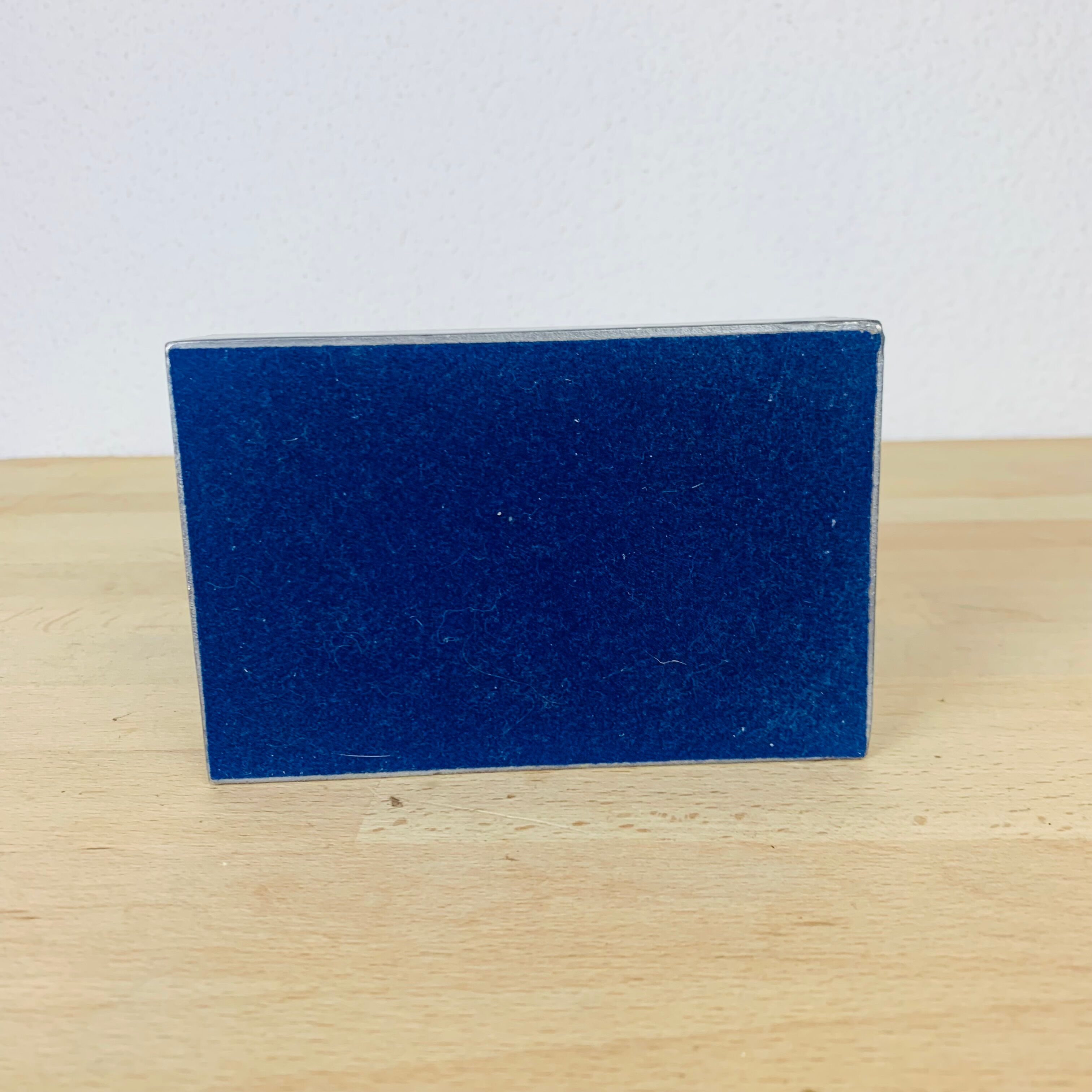 Decorative metal box and blue glass